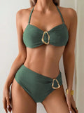 Green Tropi High Waisted Bikini Set with tropical leaf print with gold buckles from 7th of April boutique  worn by a model against a neutral background