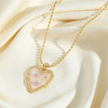 Waterproof Corazon Florencio Gold Heart Necklace with Pink Floral Inlay in 18K gold