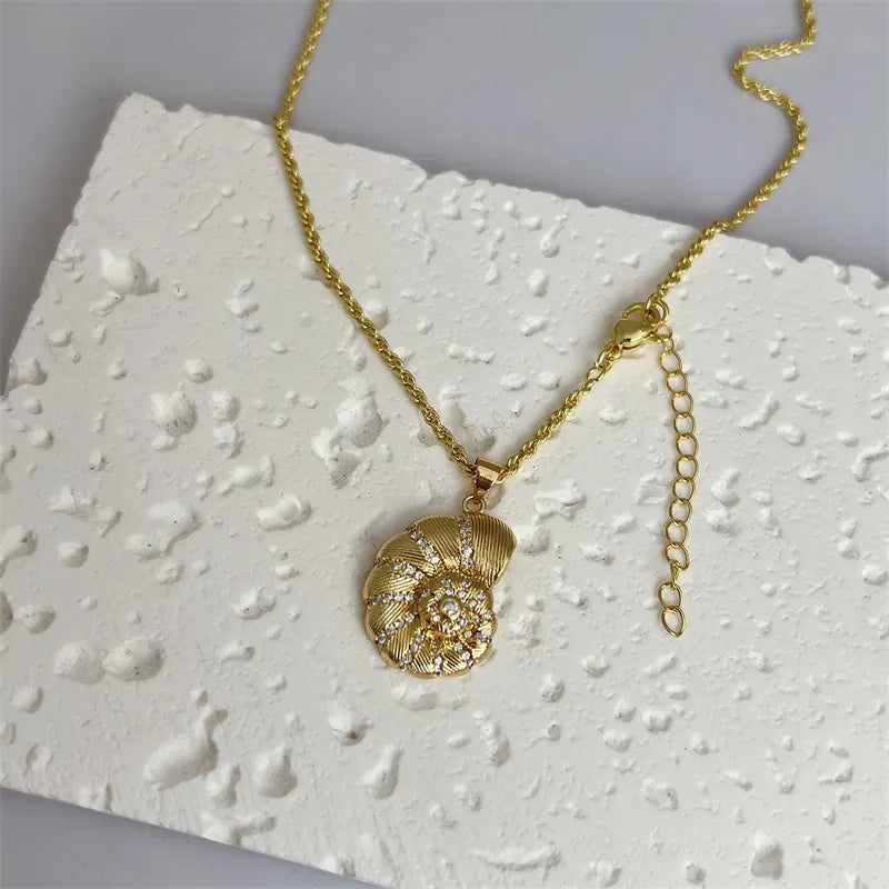 Waterproof Gold Conch Shell Charm Necklace in 18K gold plated stainless steel | 7th of April