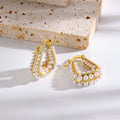 Waterproof Gold North Sea Hoop Earrings in 18K gold plated stainless steel on a light background