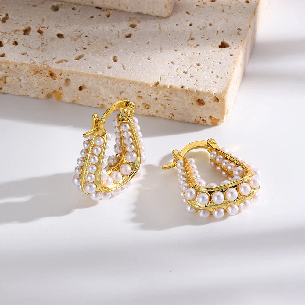 Waterproof Gold North Sea Hoop Earrings in 18K gold plated stainless steel on a light background