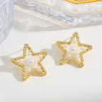 Waterproof Gold Perla Estrella Star Earrings in 18K gold plated stainless steel on a light background