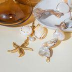 Waterproof Gold Starfish Charm Pendant Necklace in 18K gold plated stainless steel on a light background |7th of April