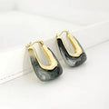 Pair of Waterproof Gold Tide Wave Earring Set in 18K gold plated stainless steel on a white surface | 7th of April
