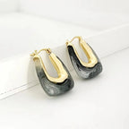 Pair of Waterproof Gold Tide Wave Earring Set in 18K gold plated stainless steel on a white surface | 7th of April